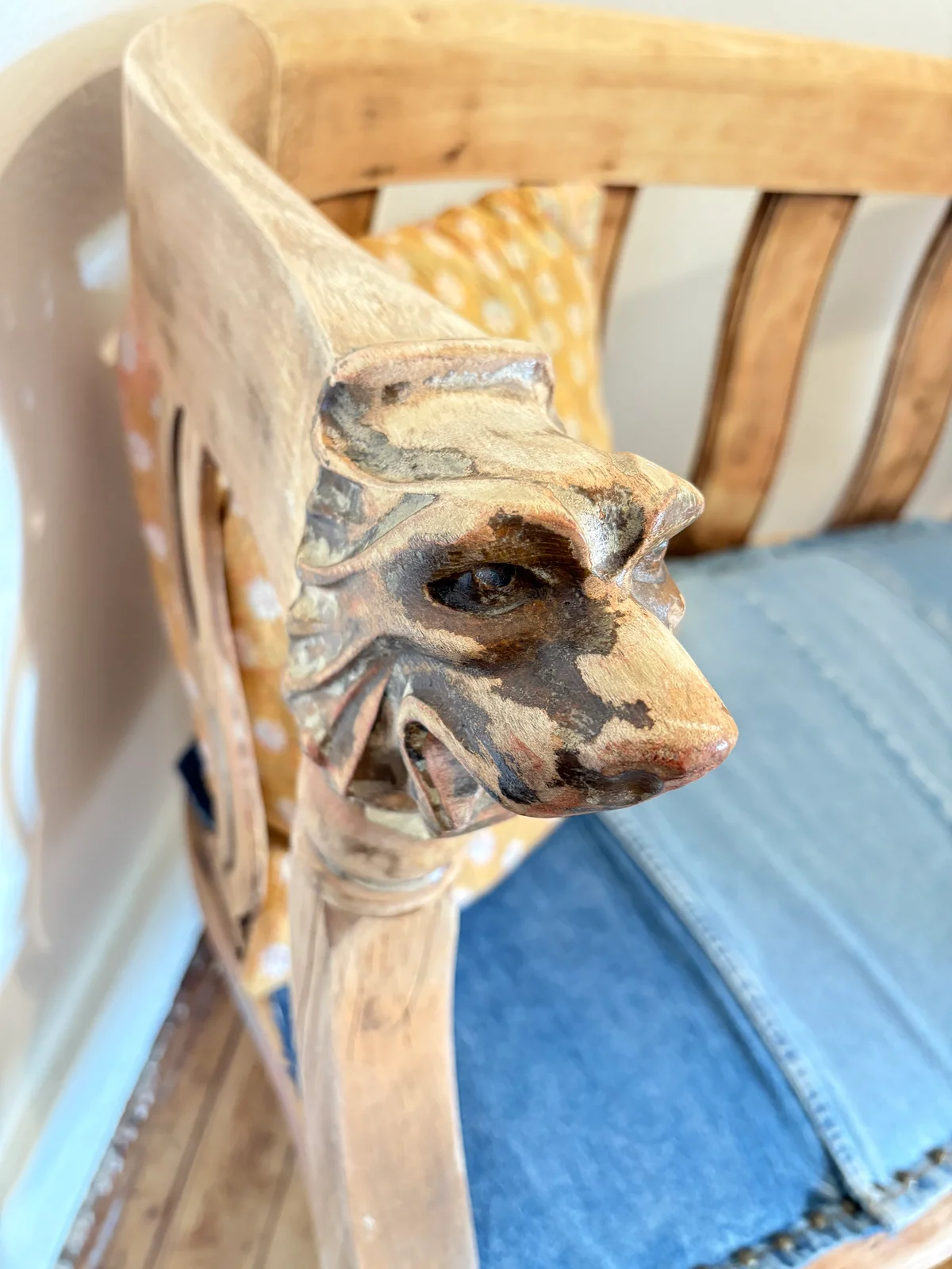 A detailed closeup of the ornate, distressed handle of a piece of furniture.